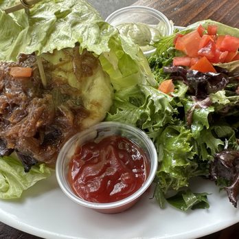 Left Bank Burger Bar - Mon Cheri burger in a lettuce wrap and side salad - Burgers Near Me - Jersey City, New Jersey Left Bank Burger Bar - Mon Cheri burger in a lettuce wrap and side salad - Burgers Near Me - Jersey City, New Jersey