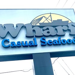 The Wharf Casual Seafood - Outdoor sign.