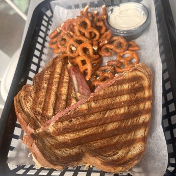 ByGeorge Brewing - Great Reuben and seasoned pretzels from the Driftwood Deli attached to By George - Breweries Near Me - Munising, Michigan