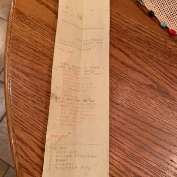 Big Orange | West Little Rock - a receipt on a wooden table - Burgers Near Me - Little Rock, Arkansas