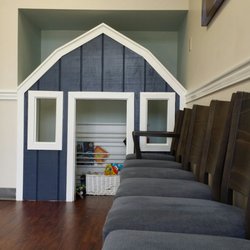 Mortenson Family Dental - Waiting area with a kids play house