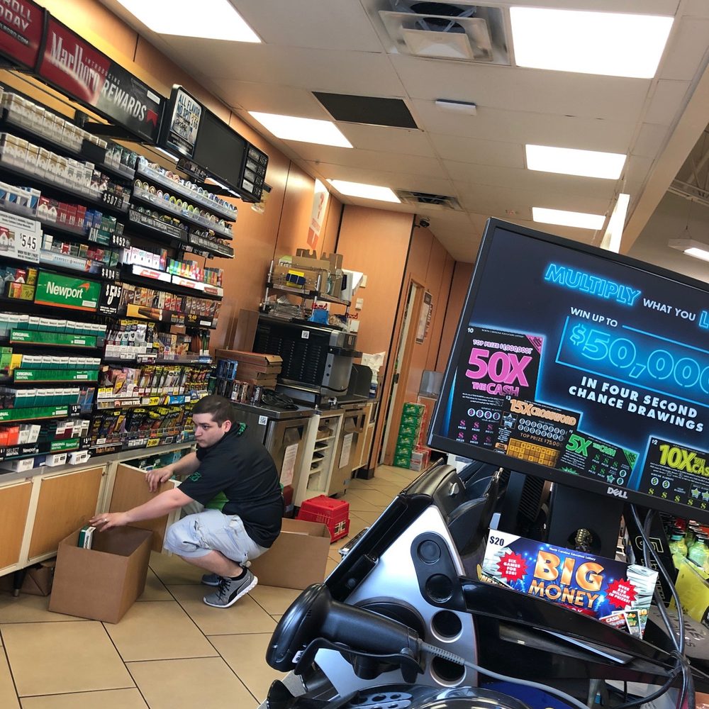 7-Eleven - a man working in a store - Gas Stations Near Me - Charlotte, North Carolina 7-Eleven - a man working in a store - Gas Stations Near Me - Charlotte, North Carolina
