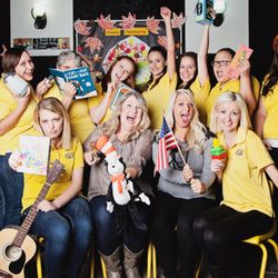 Beehive Learning Academy - 2014 Staff in goofy poses. All wearing Beehive T's. Two directors center front.