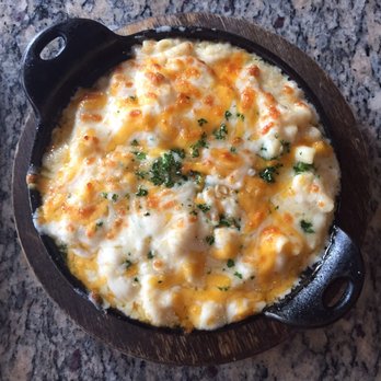 Lucille's - The mac and cheese of your dreams. Hint of truffle, served in a cast iron skillet, a variety of cheeses mmmm - New American Near Me - Houston, Texas