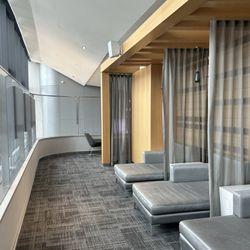 American Airlines Admirals Club - Yes, it's worth a walk to the back to put your feet up and watch the show or catch some Zzzzzz