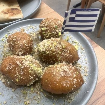 Grape Leaf Greek Kouzina - Loukoumades-Greek donuts with honey and crushed pistachios - Greek Near Me - Glendora, California Grape Leaf Greek Kouzina - Loukoumades-Greek donuts with honey and crushed pistachios - Greek Near Me - Glendora, California