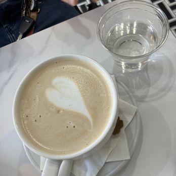 Toast Noir Cafe - Latte - it's massive, water cup for size reference - Coffee & Tea Near Me - Atlanta, Georgia Toast Noir Cafe - Latte - it's massive, water cup for size reference - Coffee & Tea Near Me - Atlanta, Georgia