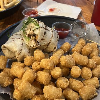 Henry's Restaurant & Bar - I go the Caesar salad wrap with tots - American Near Me - Columbia, South Carolina