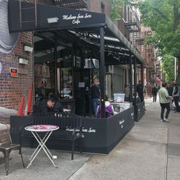 Exterior outside entrance of Madame Sousou Cafe - The storefront - Astoria, New York Exterior outside entrance of Madame Sousou Cafe - The storefront - Astoria, New York