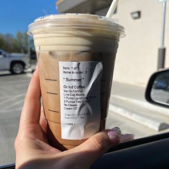 Starbucks - a hand holding a cup of iced coffee - Coffee & Tea Near Me - Oklahoma City, Oklahoma Starbucks - a hand holding a cup of iced coffee - Coffee & Tea Near Me - Oklahoma City, Oklahoma
