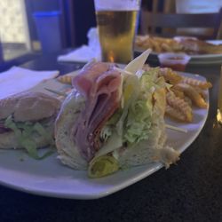 45th St Pub & Grill - Grinder sandwich, and turkey bacon, Swiss in the background.