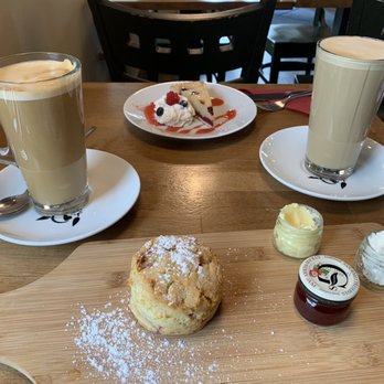 Trim & Healthy - oat milk latte, regular latte, vegan raspberry and almond tart, vegan raspberry scone with strawberry jam, vegan butter and rice cream - Delis Near Me - Navan, MH