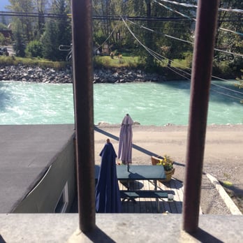 Bacchus Cafe  - View through the antique iron bars upstairs out to the patio and river. - Cafes Near Me - Golden, British Columbia