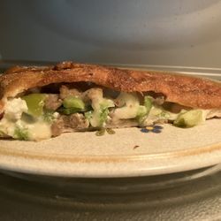 Reheating last third of an Italian sausage/green pepper .Small Calzone. 19MAY26
