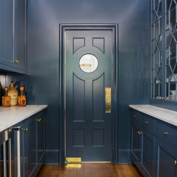RKA Construction - a kitchen with blue cabinets and marble countertops - General Contractors Near Me - Memphis, Tennessee RKA Construction - a kitchen with blue cabinets and marble countertops - General Contractors Near Me - Memphis, Tennessee