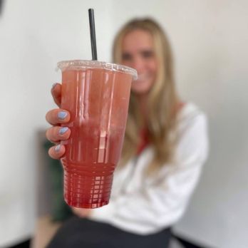 Bliss Allendale - a woman sitting on a stool holding a drink - Cafes Near Me - Allendale, Michigan Bliss Allendale - a woman sitting on a stool holding a drink - Cafes Near Me - Allendale, Michigan