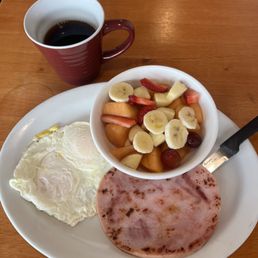 2 eggs over easy with a ham steak. A large bowl of fruit, and coffee!