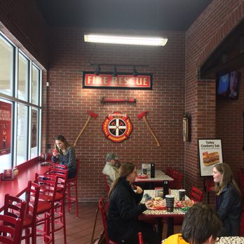 Firehouse Subs - a group of people sitting at a table - Sandwiches Near Me - Wichita, Kansas Firehouse Subs - a group of people sitting at a table - Sandwiches Near Me - Wichita, Kansas