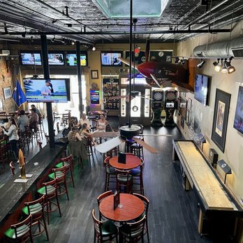 Bad Monkey - the inside of a bar with tables and chairs - Pubs Near Me - Ybor City, Florida