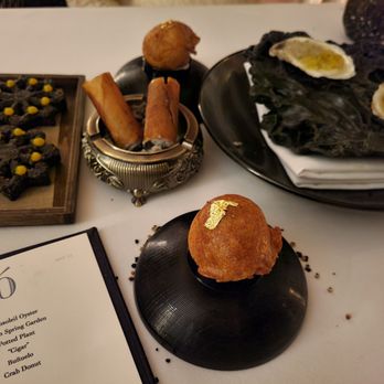 Zero Restaurant + Bar - Buñelo, "Cigar" (served in an ash tray!) Crab donut - New American Near Me - Charleston, South Carolina Zero Restaurant + Bar - Buñelo, "Cigar" (served in an ash tray!) Crab donut - New American Near Me - Charleston, South Carolina