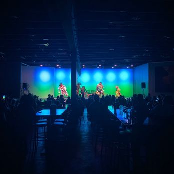 Red Heritage - a band performing on stage in a dark room - Performing Arts Near Me - Page, Arizona