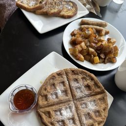 Gluten free waffles, gluten free French toast, potatoes, and sausage.