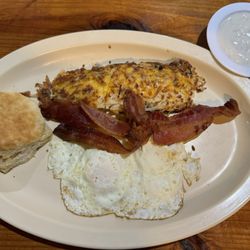 Backroads Diner - Bacon and 2 eggs breakfast plate with biscuit, gravy, and hashbrowns with cheese and onions.