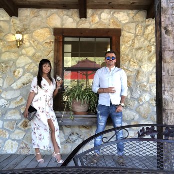 William Perry - a man and a woman standing on a patio - Wineries Near Me - Saint Helena, California William Perry - a man and a woman standing on a patio - Wineries Near Me - Saint Helena, California