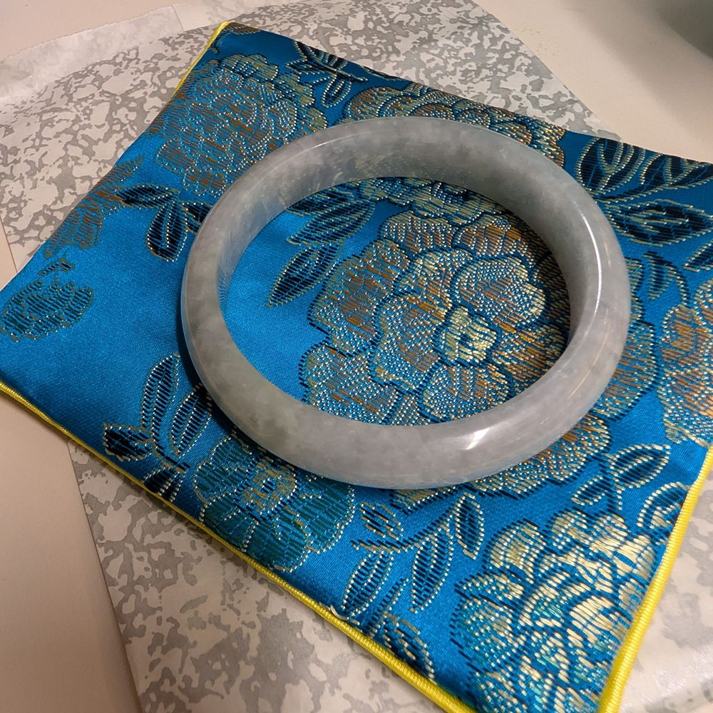 Grade A authentic Jade bangle, I love the grey/ bluish colors. Didn't want the traditional green jade