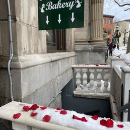 red rose petals on the railing