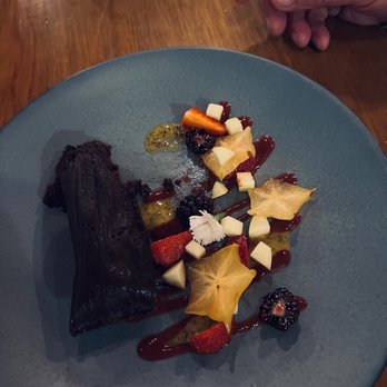 Las Quince Letras - A chocolate tamale dessert, with complementary fruit. - Oaxacan Near Me - Oaxaca, OAX Las Quince Letras - A chocolate tamale dessert, with complementary fruit. - Oaxacan Near Me - Oaxaca, OAX