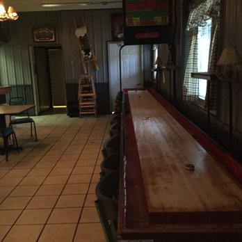 Horn Creek Pub - a shuffle table in the middle of the room - Bars Near Me - Delton, Michigan Horn Creek Pub - a shuffle table in the middle of the room - Bars Near Me - Delton, Michigan