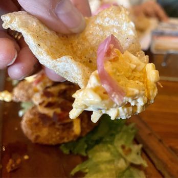 Lunch. Supper! - First bite of pork rind with pimento cheese - New American Near Me - Richmond, Virginia Lunch. Supper! - First bite of pork rind with pimento cheese - New American Near Me - Richmond, Virginia