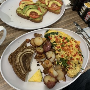 @ The Diner - Avocado toast and healthy omelette with home potatoes snd rye bread. - Breakfast & Brunch Near Me - Orlando, Florida @ The Diner - Avocado toast and healthy omelette with home potatoes snd rye bread. - Breakfast & Brunch Near Me - Orlando, Florida