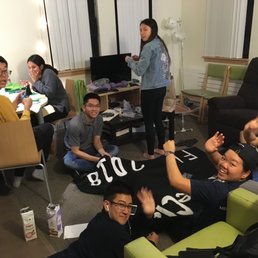 Berkeley Metropolitan - Girlfriend hosting a sewing exercise in the living room. My suite's living room is abnormally large. Other suites don't have it as large. - Apartments Near Me - Berkeley, California
