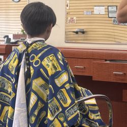 Design Haircuts - My 6 yr old getting a haircut. he had trouble staying still  :( Lynn was amazing with him! my son loves his haircut(: