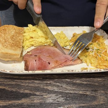 Eggington's - Scrambled eggs, ham, with cheesy hash browns and sourdough toast. - Breakfast & Brunch Near Me - Casper, Wyoming Eggington's - Scrambled eggs, ham, with cheesy hash browns and sourdough toast. - Breakfast & Brunch Near Me - Casper, Wyoming
