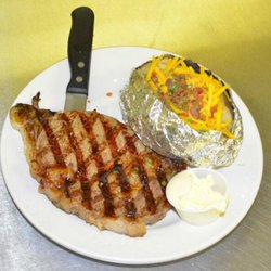 Steddy's - Our hand cut ribeye is served with a side & salad.