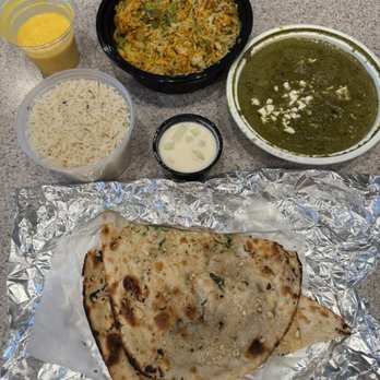 Chaska - Garlic naan, saag paneer, veg biryani, and a delicious mango yogurt drink. - Indian Near Me - Greenfield, Indiana