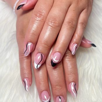 StarNailsBar - This nail set features a soft pink base with elegant black-and-white curved accents, - Nail Salons Near Me - Vista, California StarNailsBar - This nail set features a soft pink base with elegant black-and-white curved accents, - Nail Salons Near Me - Vista, California