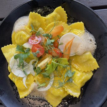 Il Lusso - Seafood Mezzaluna pasta - The handmade raviolis are filled with spiny lobster, crab, and grouper, and there is a saffron satsuma emulsion - Steakhouses Near Me - Tallahassee, Florida