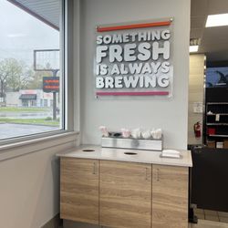 Dunkin' - Silverware station and trash area