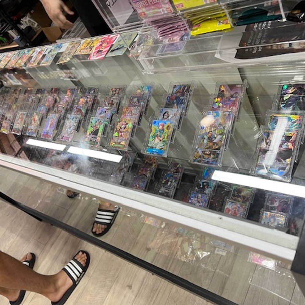 Top Choice Gaming - display case of cards - Tabletop Games Near Me - Redlands, California Top Choice Gaming - display case of cards - Tabletop Games Near Me - Redlands, California