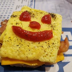 McDonald's - Folded egg, bacon egg/cheese on biscuit.