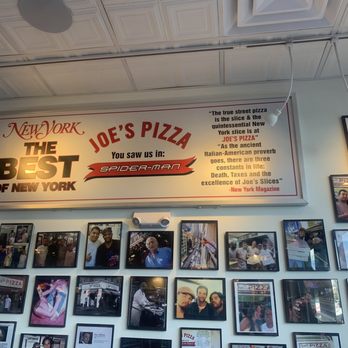 Joe's Pizza - Sign, with wall of photos - Pizza Near Me - Miami, Florida