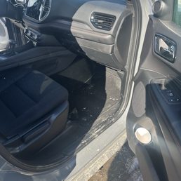 Dirty car. Used cup on the door. Dirty car. Used cup on the door.