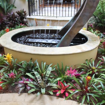 Flowerbomb Landscaping - a fountain in a garden - Landscaping Near Me Flowerbomb Landscaping - a fountain in a garden - Landscaping Near Me