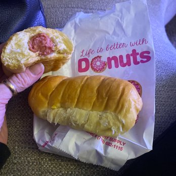 Maxco Donuts - a person holding a donut and a bag of donuts - Donuts Near Me - Houston, Texas Maxco Donuts - a person holding a donut and a bag of donuts - Donuts Near Me - Houston, Texas