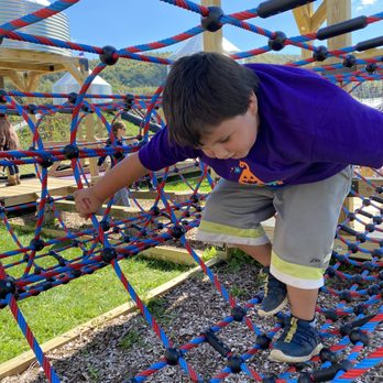Pumpkinville - Channeling his inner Spider-Man on the all new rope and rock wall agility area. - Pumpkin Patches Near Me - Great Valley, New York Pumpkinville - Channeling his inner Spider-Man on the all new rope and rock wall agility area. - Pumpkin Patches Near Me - Great Valley, New York