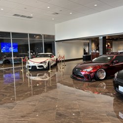 Ammaar's Toyota Vacaville - Shiny clean showroom floor. Coffee bar in background.